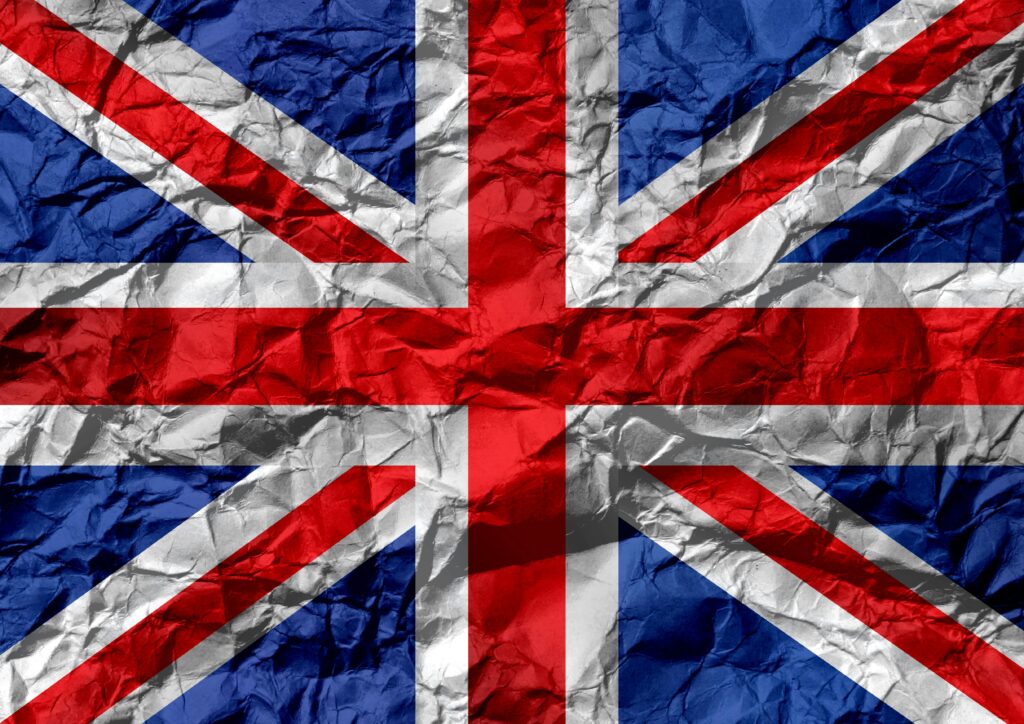 Crumpled texture of the Union Jack flag, symbolizing UK unity and heritage.